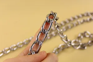 Macro detail showing heavy duty silver metal chain links for anti-chew dog leash