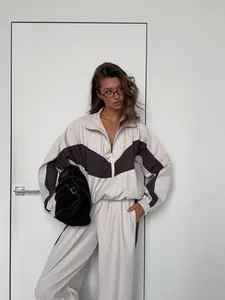 Chic women's oversized color-block tracksuit set featuring zip-up jacket and joggers