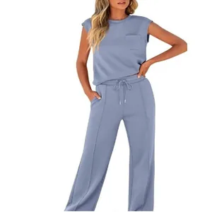 Full view of women's blue sleeveless pocket top and wide-leg drawstring pants set