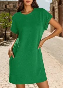 Detail of vibrant green short sleeve dress featuring round neck and rolled cuffs.