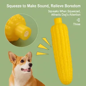 Detailed macro view of yellow corn squeaky dog toy showing the sound mechanism detail