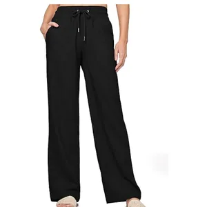 Detail view of black linen wide-leg pants with high waist and drawstring pockets