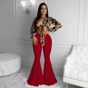 Elegant red bell-bottom flare pants set featuring a baroque print long sleeve crop top