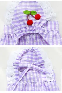 Close-up of purple gingham pet dress with lace trim and cherry applique detail.