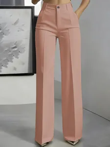 Close-up detail view of high-waisted pink straight-leg dress pants with vertical crease