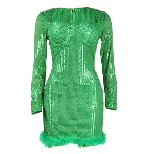 Elegant green sequined mini dress featuring long sleeves and faux feather hem detail