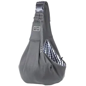 Detail view of an adjustable dark grey pet sling carrier with a buckle strap.