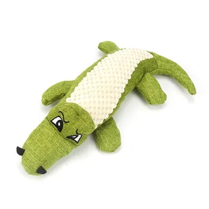 Peluche crocodile pour chien durable et sonore avec ventre texturé sur fond blanc