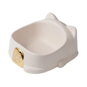 Elegant light pink cat-shaped pet bowl featuring a gold Maneki-neko fortune plaque design.