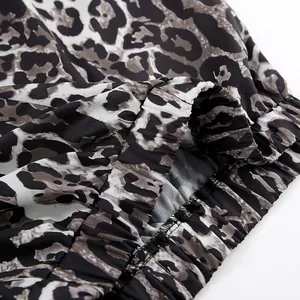 Detailed macro view of the elasticated waistband on these leopard print wide leg pants