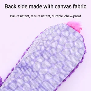 Détail du dos en toile durable du jouet en peluche lézard pour chiens