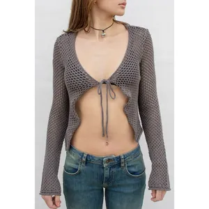 Detailed view of grey hollow knit long sleeve cardigan with elegant front tie bow