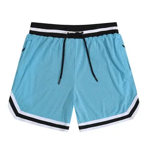 Detail of men's mesh athletic shorts with striped waistband and drawstring closure.