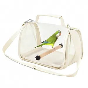 Portable cream bird carrier bag with transparent window and wooden perch for parrot outing travel