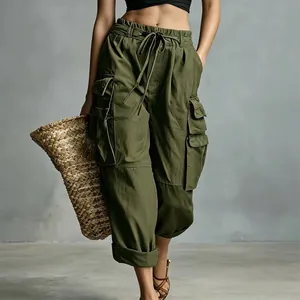 Close-up of women's olive green high-waisted cargo pants with multiple side pockets