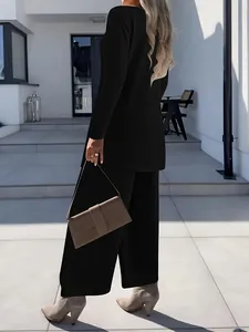 Elegant black three-piece set with long-sleeve cardigan and wide-leg trousers for women.