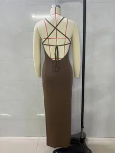 Back view of a sexy brown knitted maxi dress with open back and crisscross straps.