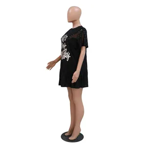 Detailed side view of black sequined short sleeve dress featuring ruffle hem design