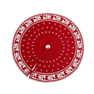 Festive red and white knitted Christmas tree skirt featuring reindeer and snowflake patterns