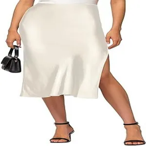 Close-up of elegant white satin midi skirt with side slit and high waist design