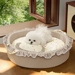 Comfortable round pet sofa bed for cats and dogs featuring heart patterns and pillow