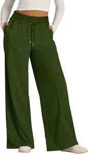 Detailed view of women's dark green wide-leg sweatpants with an adjustable drawstring waist