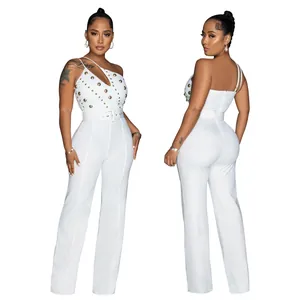 Front and back details of a stylish white one-shoulder jumpsuit with gold studs and belt