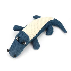 Jouet peluche crocodile pour chien avec couineur en tissu texturé bleu et crème durable
