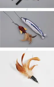Detailed view of feather and plush fish replacement heads for cat teaser wand toys.