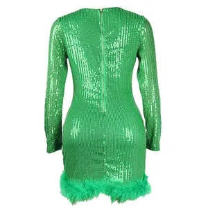 Back detail of green sequined party dress featuring feather trim and zip closure
