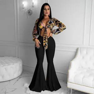 Elegant two-piece set featuring a baroque print crop top and black flare pants