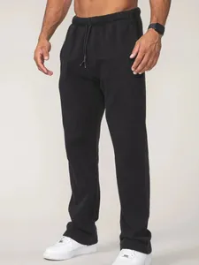 Vue détaillée du pantalon de jogging noir ample pour homme avec cordon de serrage