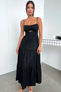 Elegant black tiered camisole maxi dress featuring a chic cut-out detail and flowy skirt
