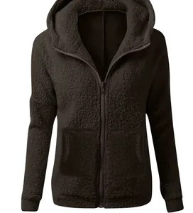 Detail showing the thick fuzzy texture and zipper of this brown Sherpa hoodie coat.
