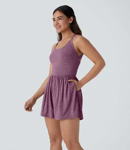 Side view of a purple sleeveless exercise dress for women featuring a side pocket