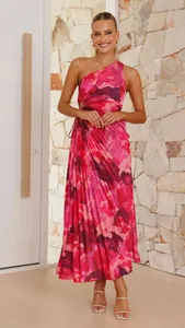 Elegant vibrant pink one-shoulder pleated floral print dress shown on a model in a bright room
