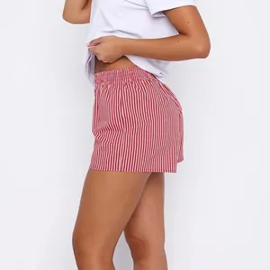 Side view detail of red and white striped women's summer loungewear pajama shorts