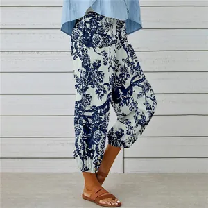 Detailed view of high-waisted cotton linen pants with vintage blue floral print