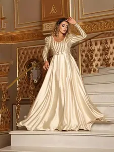Elegant champagne gold evening gown with sequined bodice and satin floor-length skirt