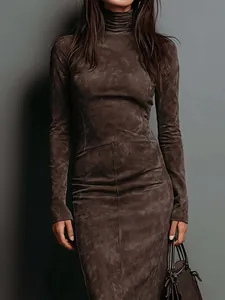 Detail view of a slim-fit long-sleeved turtleneck dress with a unique washed brown texture