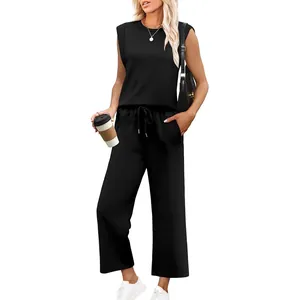 Casual two-piece set featuring black sleeveless round neck top and loose wide-leg pants.
