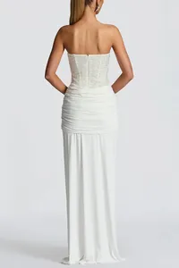 Back view of an elegant white strapless sequined bodice evening gown dress for women