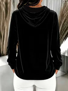 Detailed back view of a black velvet hooded sweatshirt featuring premium soft fabric texture