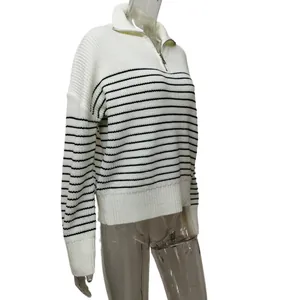 Detailed view of the soft knitted stripe sweater featuring a half-zip polo collar design.