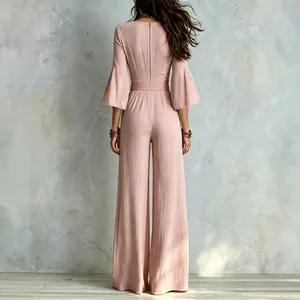 Elegant French style pink wide-leg jumpsuit with bell sleeves and high waist belt