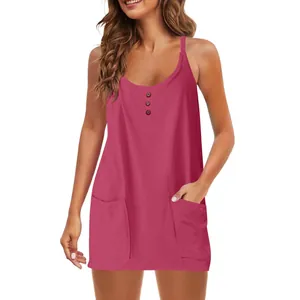 Detail shot of a women's casual sleeveless pink dress with V-neck and front pockets
