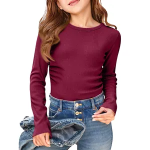 Detail shot of kids' burgundy ribbed long sleeve T-shirt with round neck and slim fit.