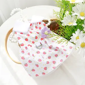 Cute strawberry print pet dress for small dogs with purple flower and white lace hem.