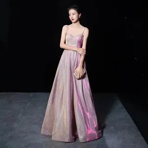 Full view of a shimmering purple evening gown with thin straps and a backless design.