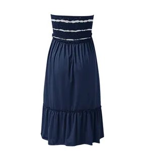 Detailed back view of a navy blue strapless shirred dress featuring ruffled hem detail